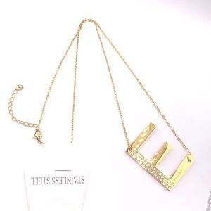 Gold monogram initial “E” rhinestone pendant necklace